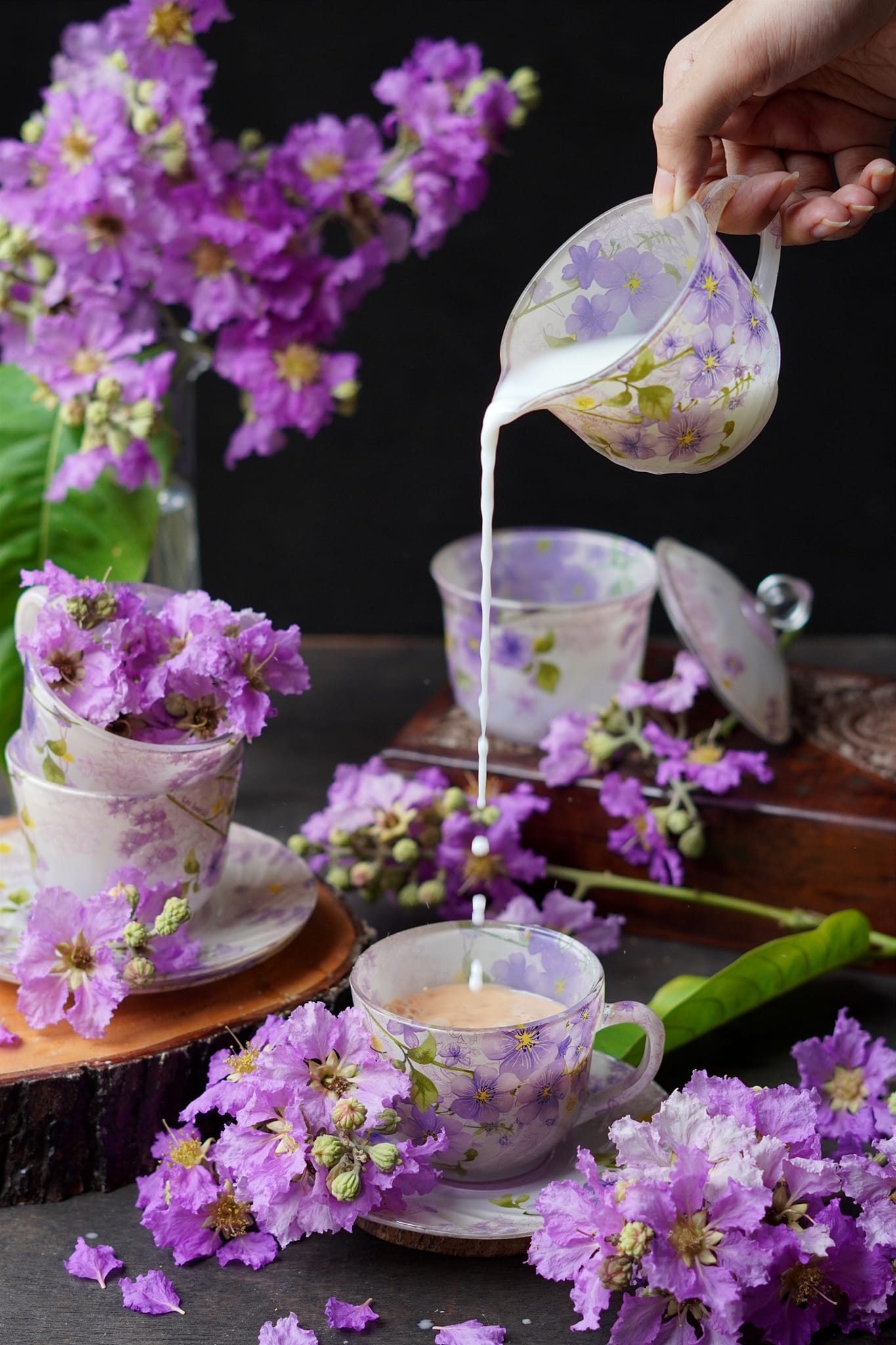 A person pouring milk